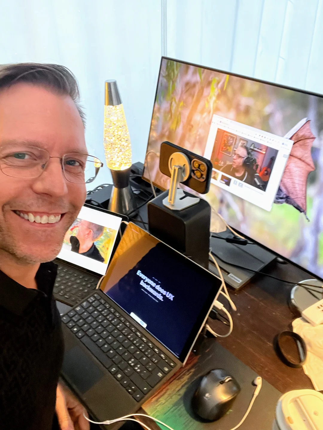 Mårten at his desk recording the podcast with BMad — monitor showing the live call, iPad running the presentation